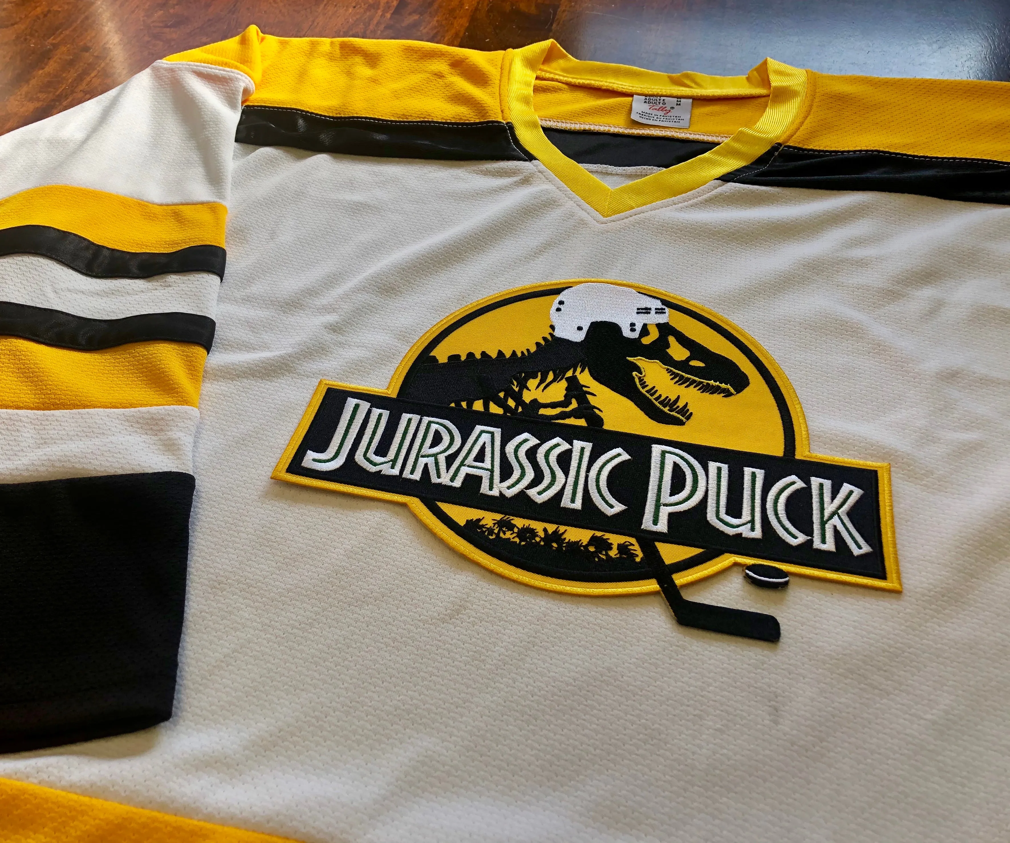 Custom Hockey Jerseys with a Jurassic Puck Embroidered Twill Logo