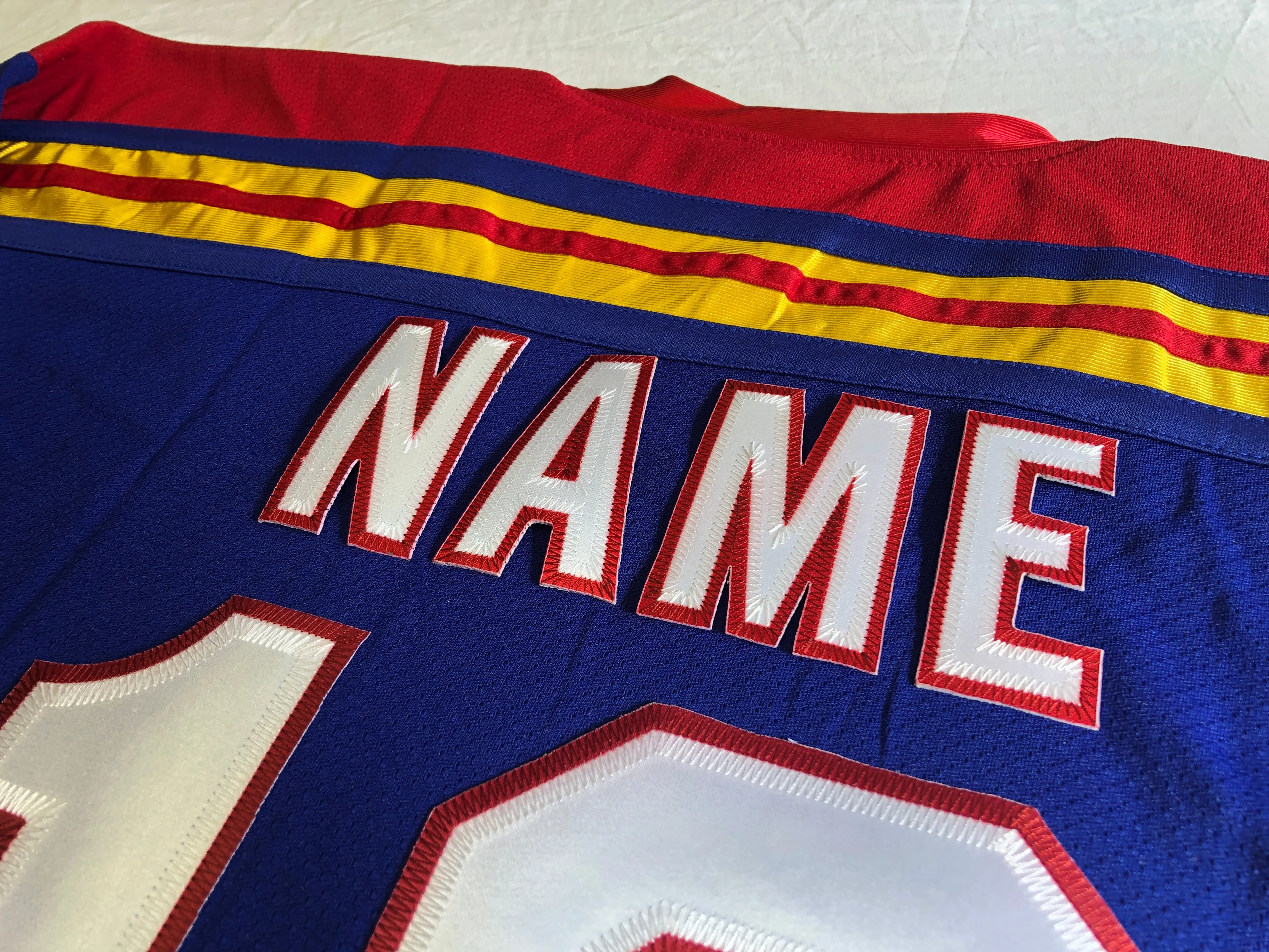 Custom Hockey Jerseys with a Lucky Embroidered Twill Logo