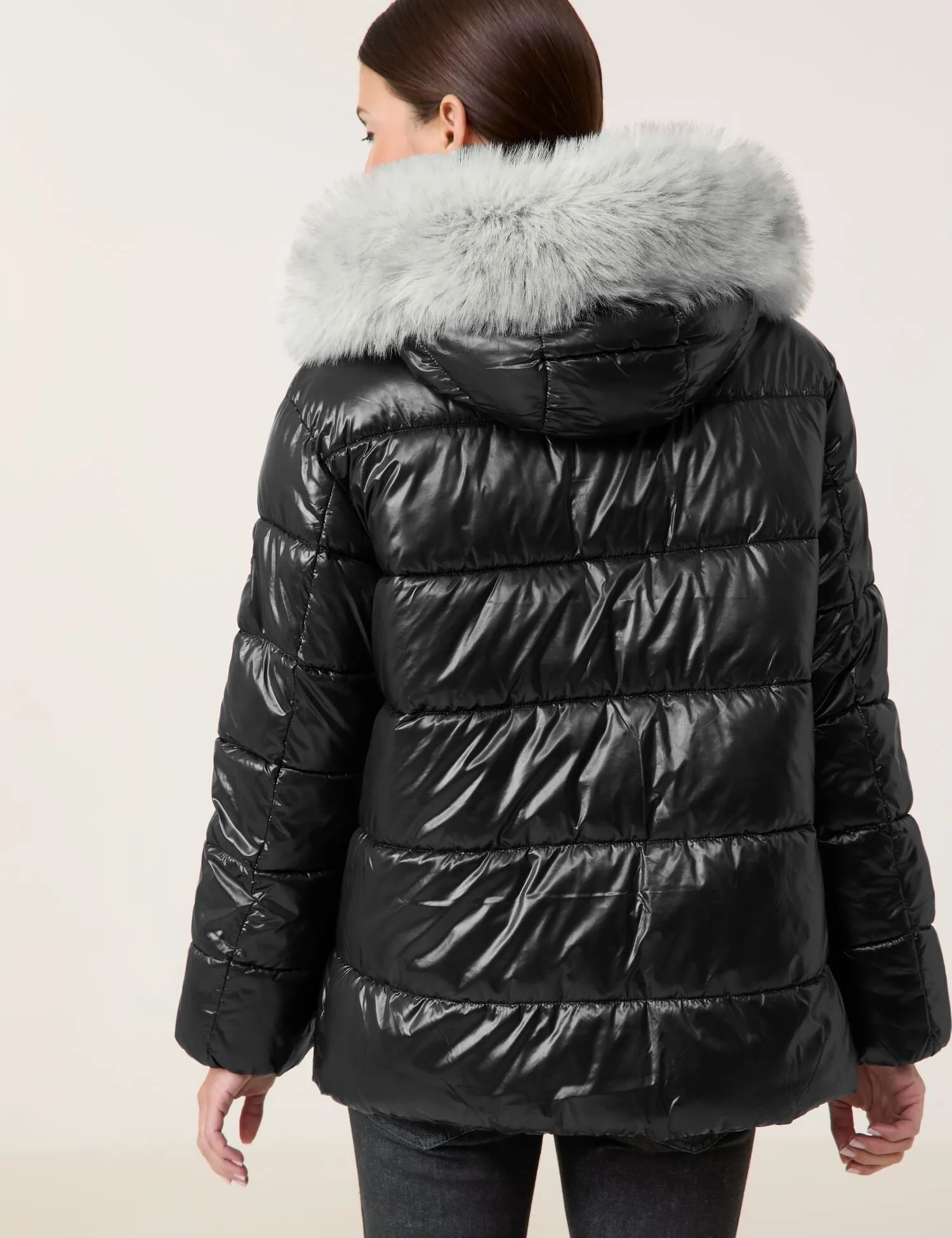 Outdoor jacket with a faux fur collar and shiny finish