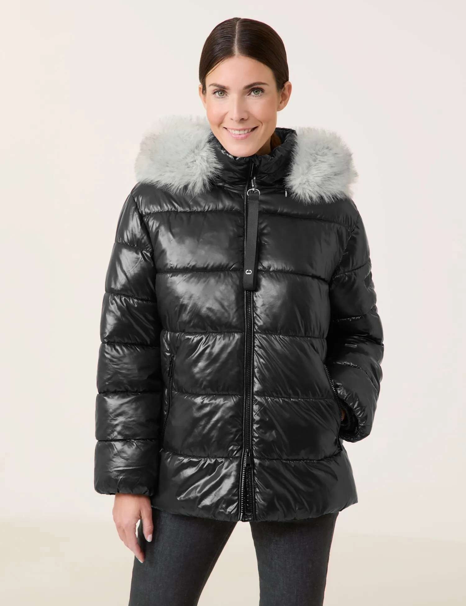 Outdoor jacket with a faux fur collar and shiny finish